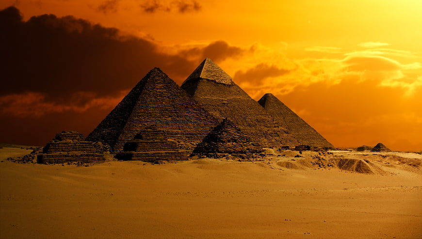 Dramatic Pyramids of Giza at Sunset in the Egyptian Desert