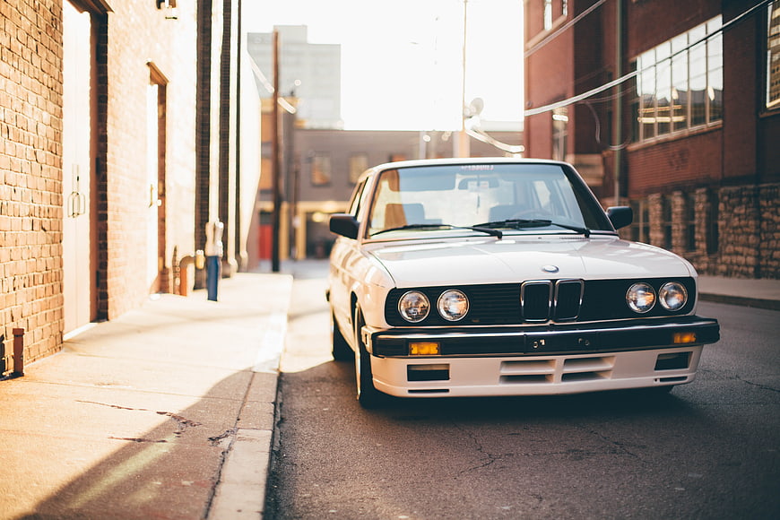 White Classic BMW E30 in Urban Brick Alley