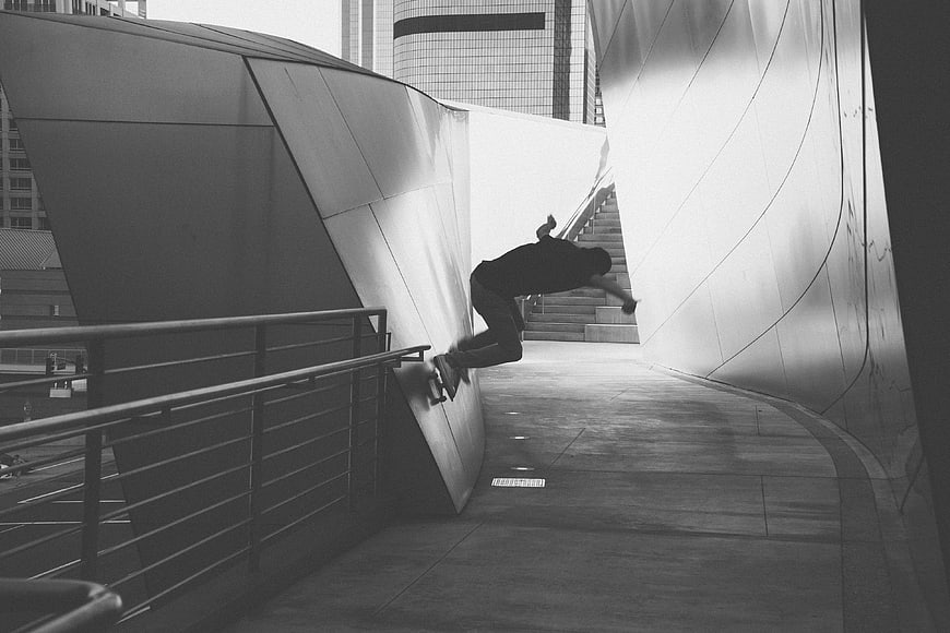 Skateboarder Grinding Rail in Modern Architecture