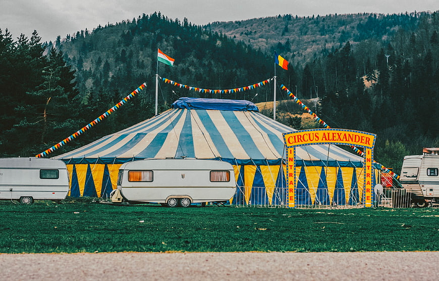 Circus Alexander Tent in Forest Setting with Caravans