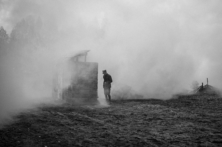 Soldier in foggy battlefield reenactment
