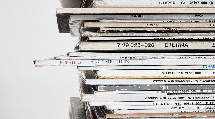Stack of vintage vinyl records with white background
