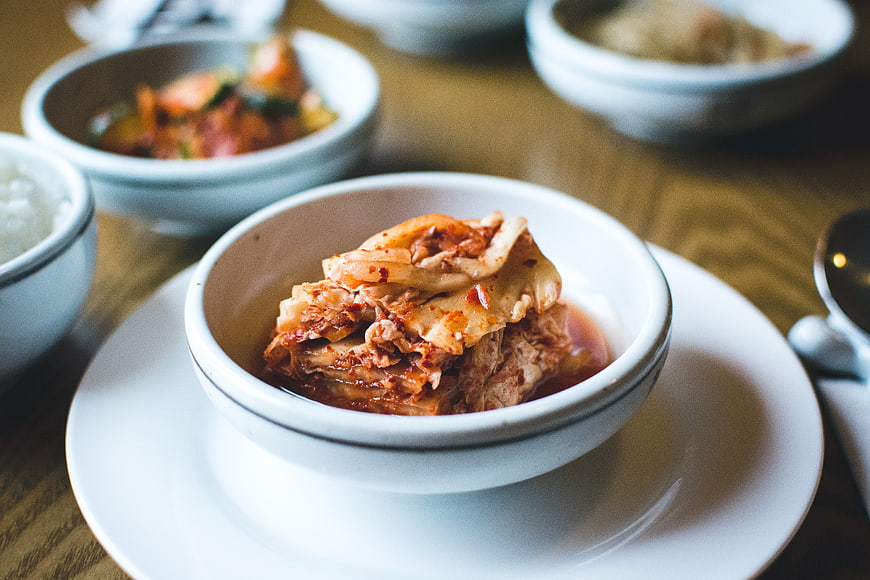 Close-up of spicy kimchi in a white ceramic bowl
