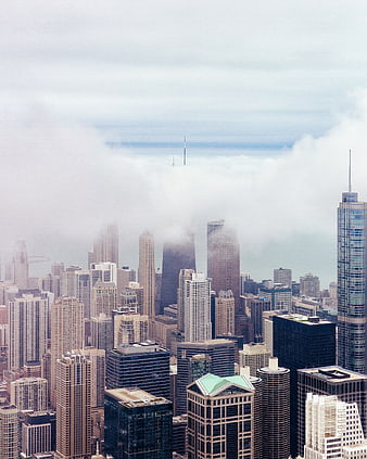 Chicago Skyline Emerging from Thick Clouds and Fog