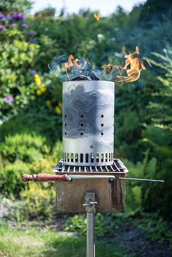 Outdoor Chimney Starter with Flames in Garden