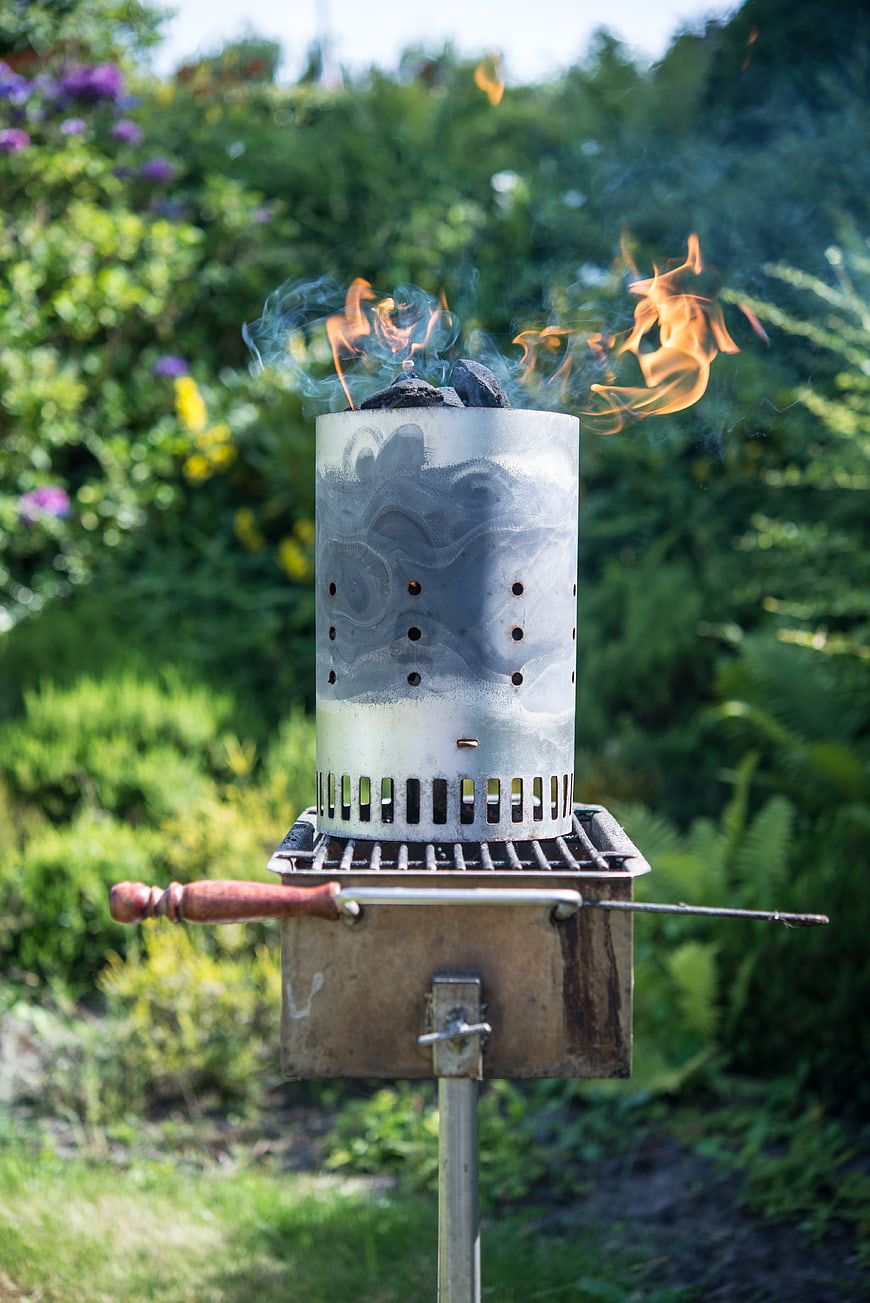 Outdoor Chimney Starter with Flames in Garden