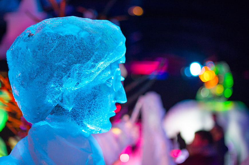 Blue Ice Sculpture Head with Bokeh Lights