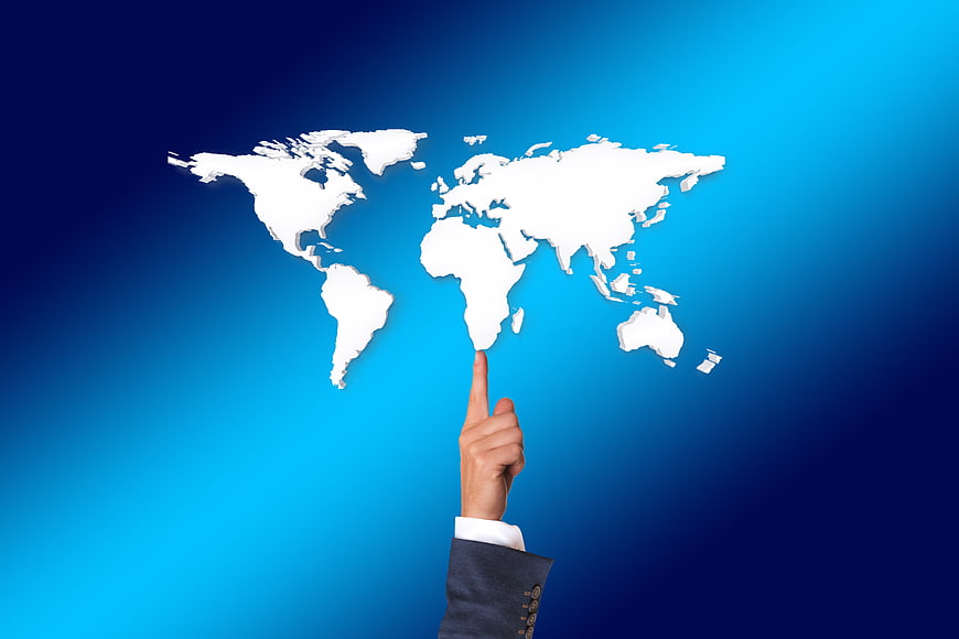 Businessman hand pointing at Africa on world map