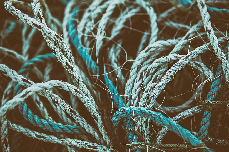 Close-up of tangled blue and white fishing ropes