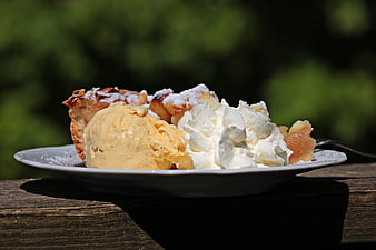 Apple Pie With Vanilla Ice Cream And Whipped Cream On White Plate