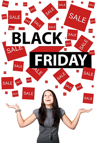 Woman celebrating Black Friday sale with floating red tags