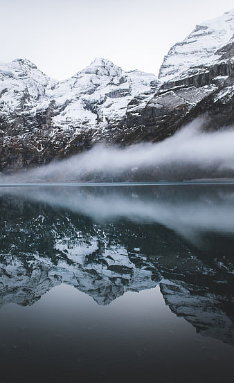 Snowy Mountain Reflection in Misty Lake