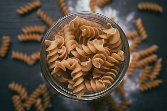 Top View of Whole Wheat Fusilli Pasta in Glass Jar