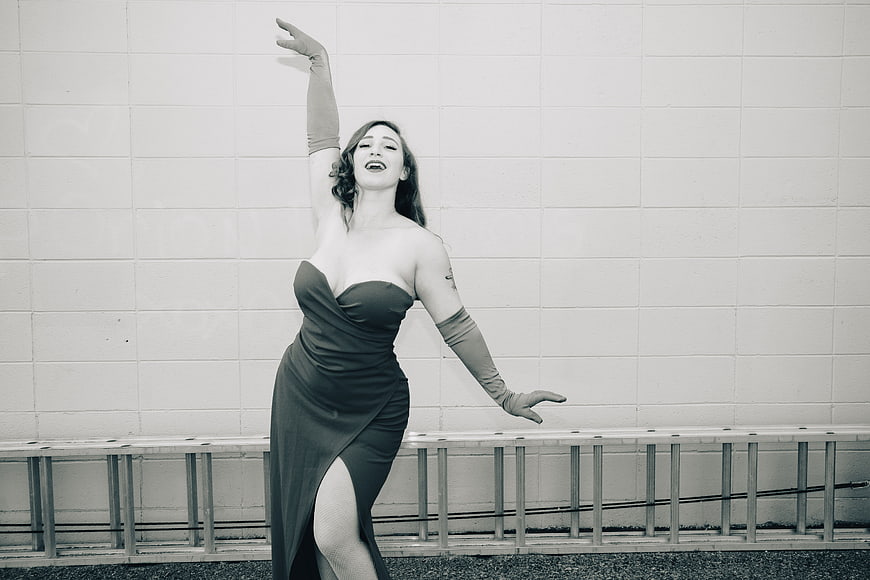 Vintage Style Woman in Evening Gown and Gloves Posing