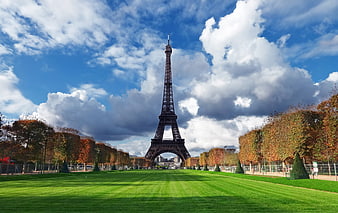 Eiffel Tower in Paris with Autumn Trees and Blue Sky