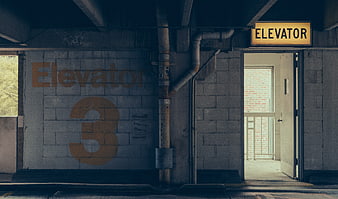 Urban Elevator 3 Entrance With Concrete Walls And Industrial Pipes