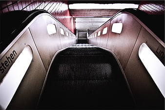 Low angle view of empty escalator in subway station