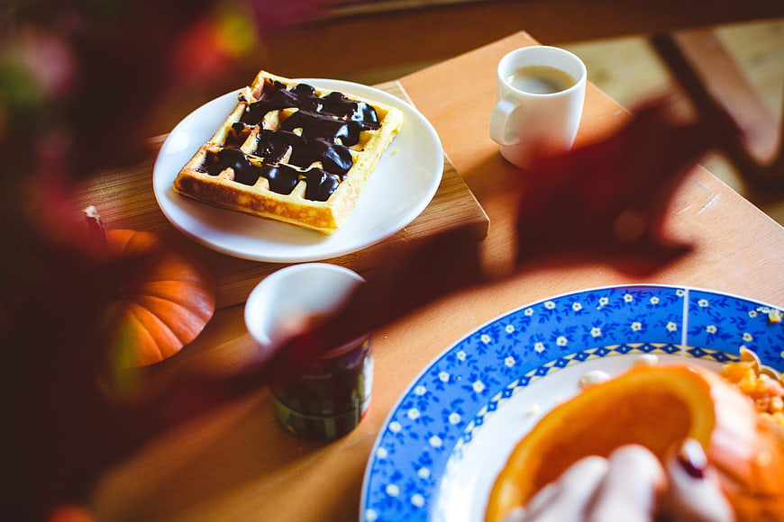Autumn breakfast with chocolate waffle and coffee