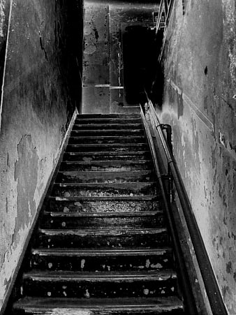 Dark vintage staircase in abandoned building