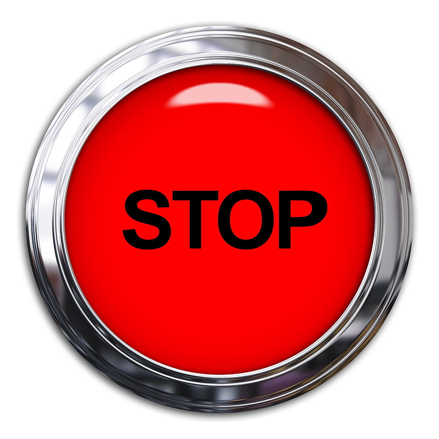 Red Stop Button with Chrome Rim on White Background