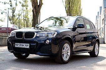 Black BMW X3 SUV Parked On Paved Street