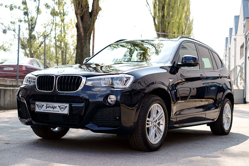 Black BMW X3 SUV Parked On Paved Street