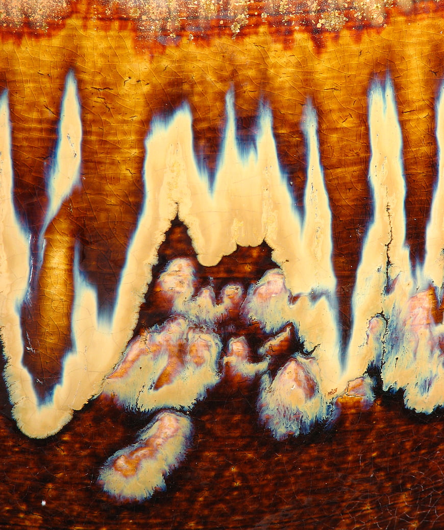 Abstract Orange and Brown Glazed Pottery Texture