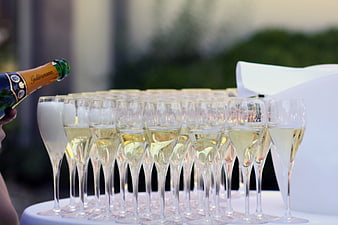 Champagne Tower Being Filled at Outdoor Wedding Celebration