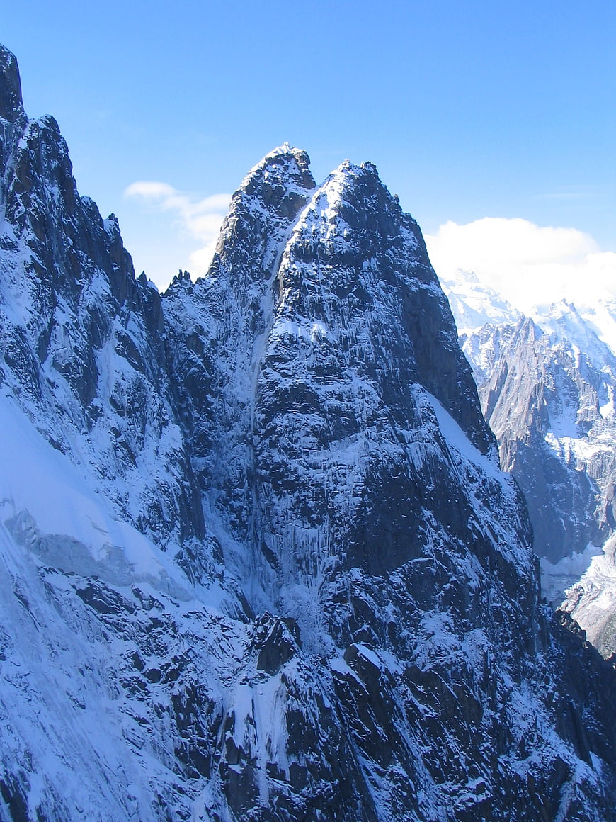Majestic Snow-Capped Mountain Peak Under Blue Sky
