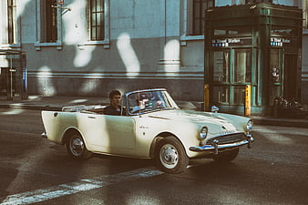 Vintage Sunbeam Alpine convertible parked on a New York City street