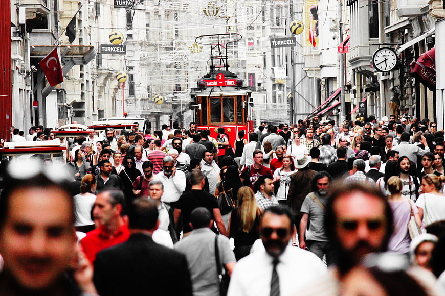 Crowded Istiklal Street in Istanbul with Historic Red Tram