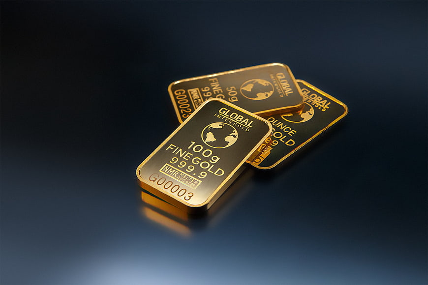 Stack of gold bars on dark blue background