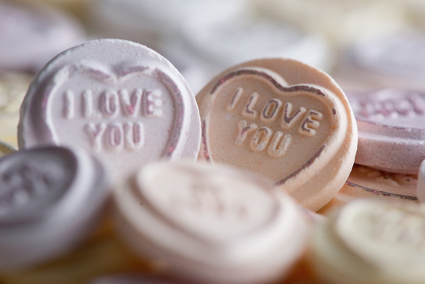 Close-up of heart-shaped 'I Love You' chocolate candies