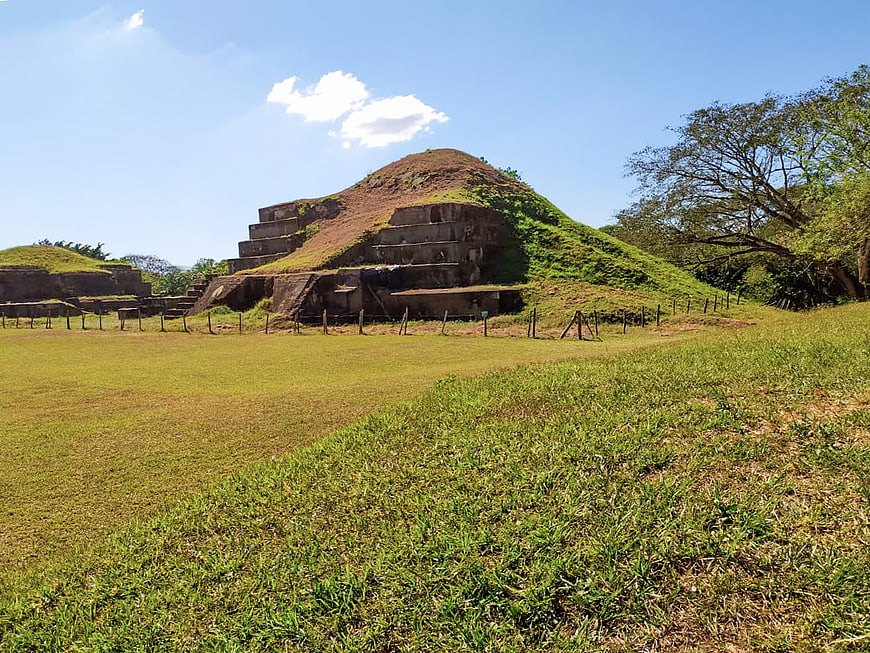 Ancient Maya Pyramid Ruins in Lush Green Landscape