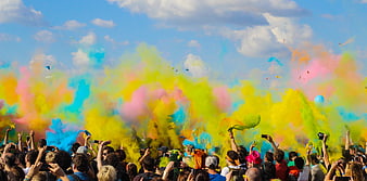 Colorful Holi Festival Crowd with Vibrant Powder Clouds