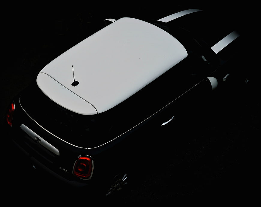 High Angle View of Black Mini Cooper with White Roof