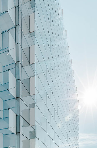 Modern Glass Skyscraper Architecture with Sun Flare