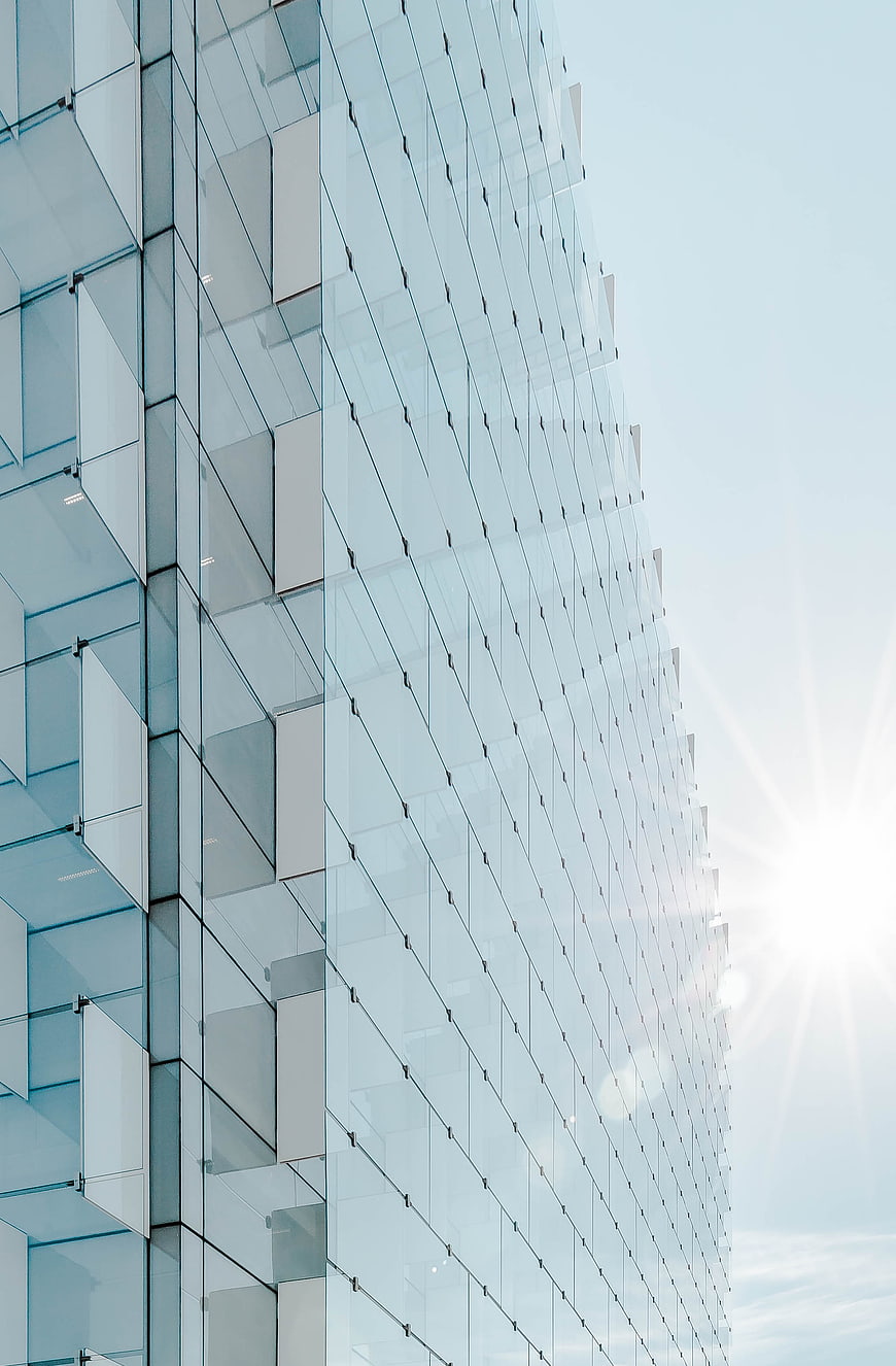 Modern Glass Skyscraper Architecture with Sun Flare