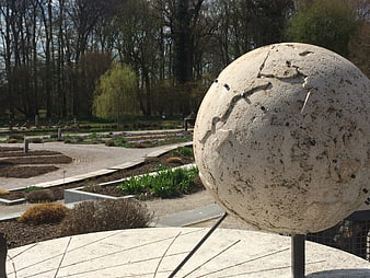 Stone Globe Sundial in a Botanical Garden