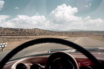 Vintage car dashboard view driving on open highway
