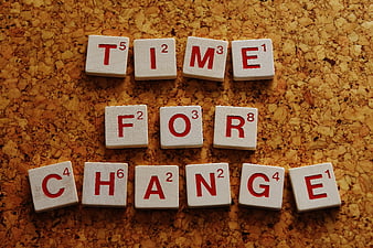 Scrabble Tiles Spelling Time For Change on Cork Board