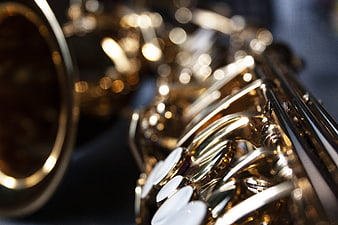 Close-up of a brass saxophone with shallow depth of field