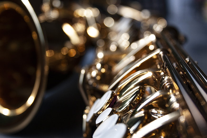 Close-up of a brass saxophone with shallow depth of field