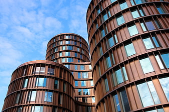 Worm's Eye View of Modern Curved Rust-Colored Office Buildings