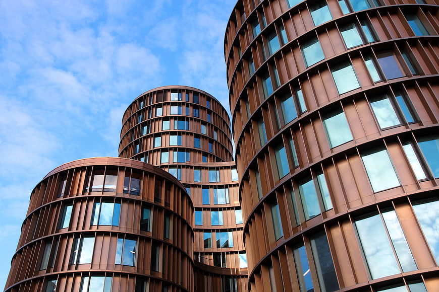 Worm's Eye View of Modern Curved Rust-Colored Office Buildings