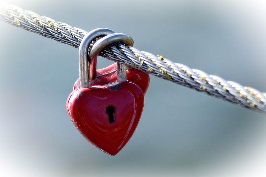 Red Heart Padlock on Metal Cable