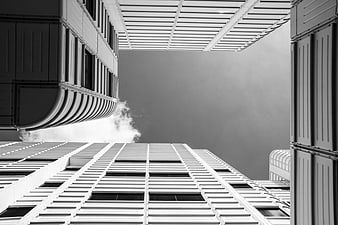 Black and white worm's eye view of modern skyscrapers