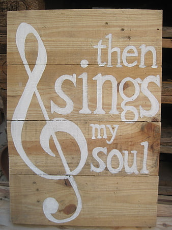 Hand-painted wooden sign with musical quote then sings my soul