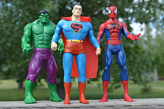 Hulk, Superman, and Spider-Man Action Figures Standing Together