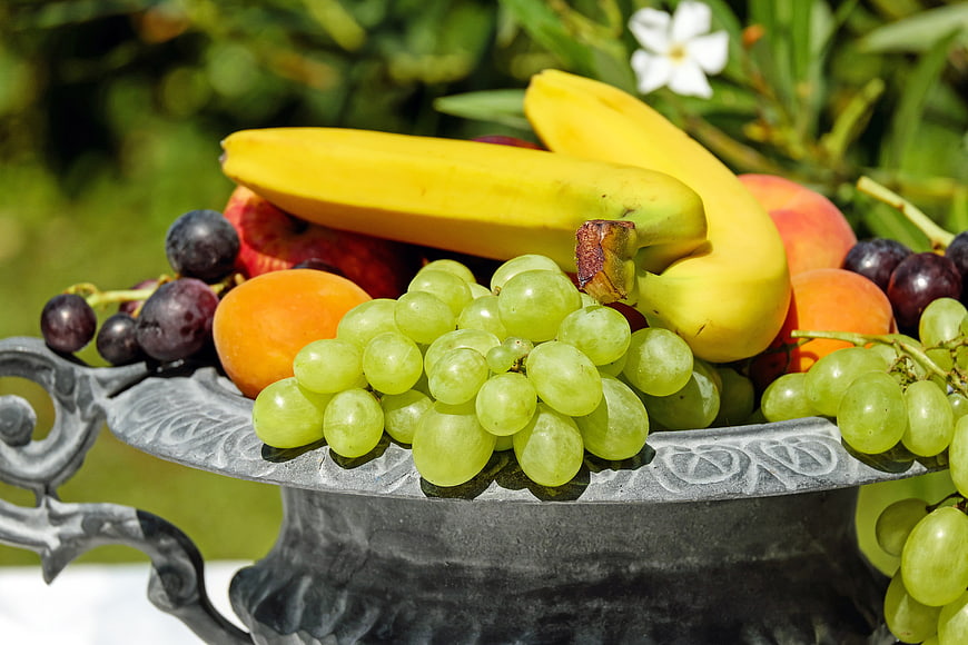 Fresh Assorted Fruits in Decorative Metal Bowl Outdoors